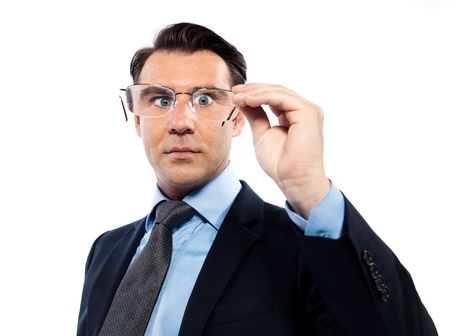 Man holding his magnifying eyeglasses in front of his face, attempting to pear into the future